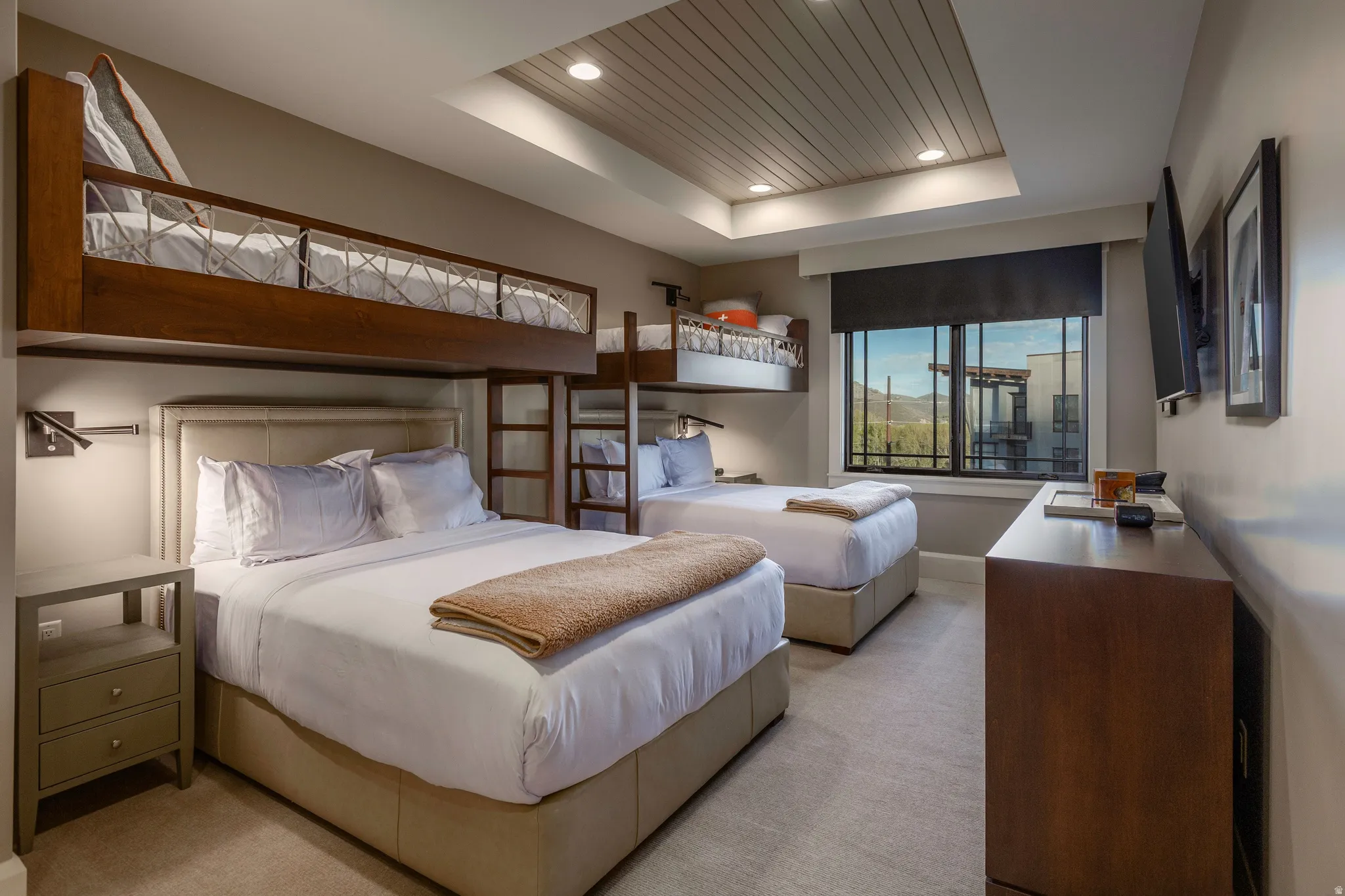 Bedroom featuring built-in bunk beds, recessed lighting, and a window with mountain scenery