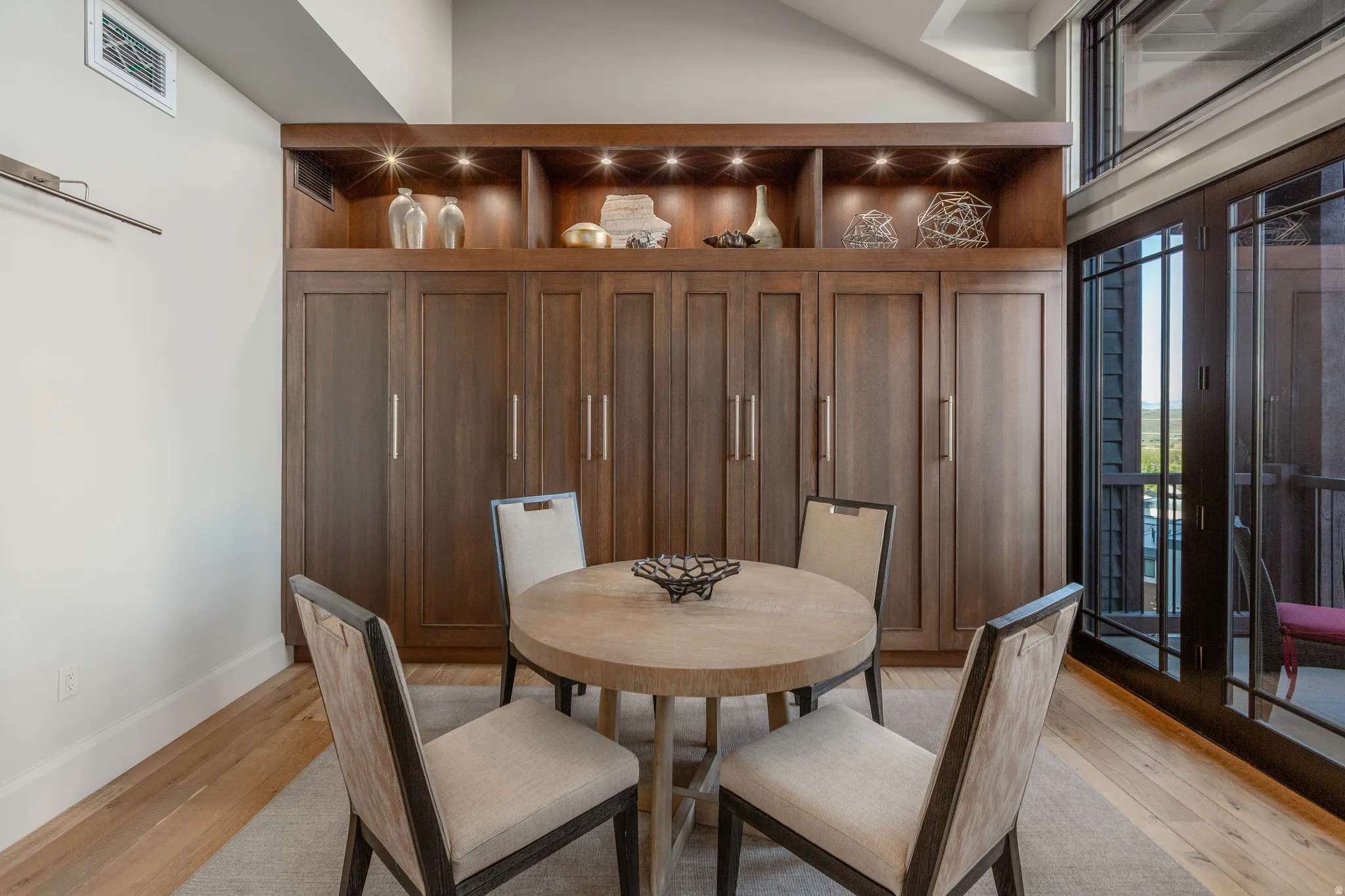 Built-in cabinetry with integrated shelving and recessed lighting