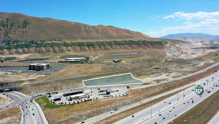 Expansive undeveloped land parcel positioned alongside a major interstate highway