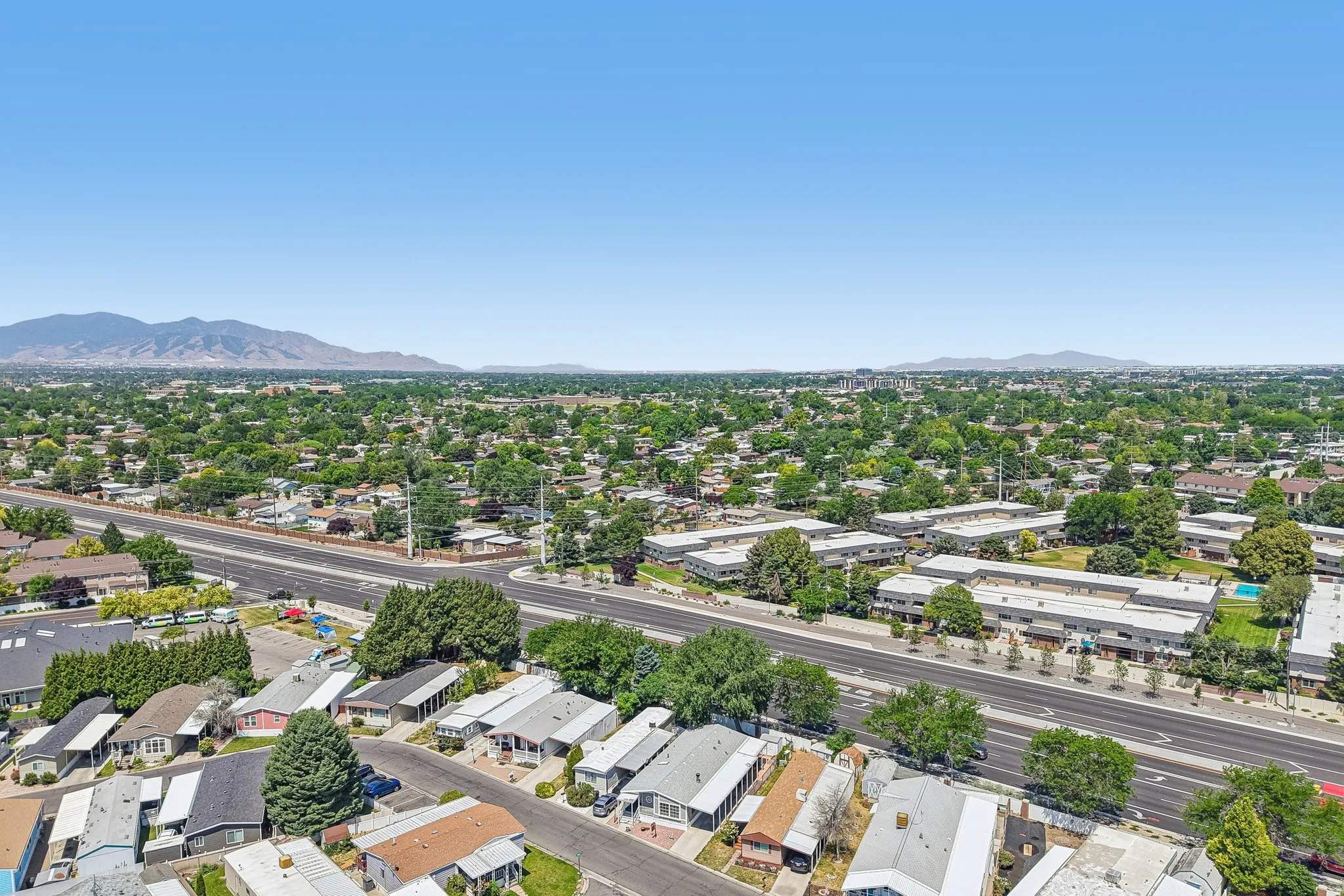 Expansive aerial perspective showcasing a residential area with varied housing types