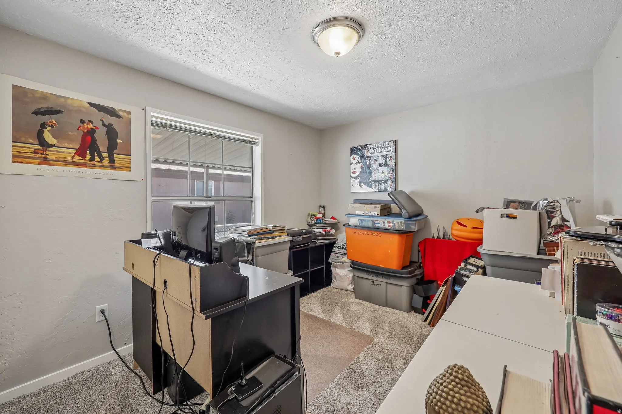 Room with neutral wall paint and textured ceiling