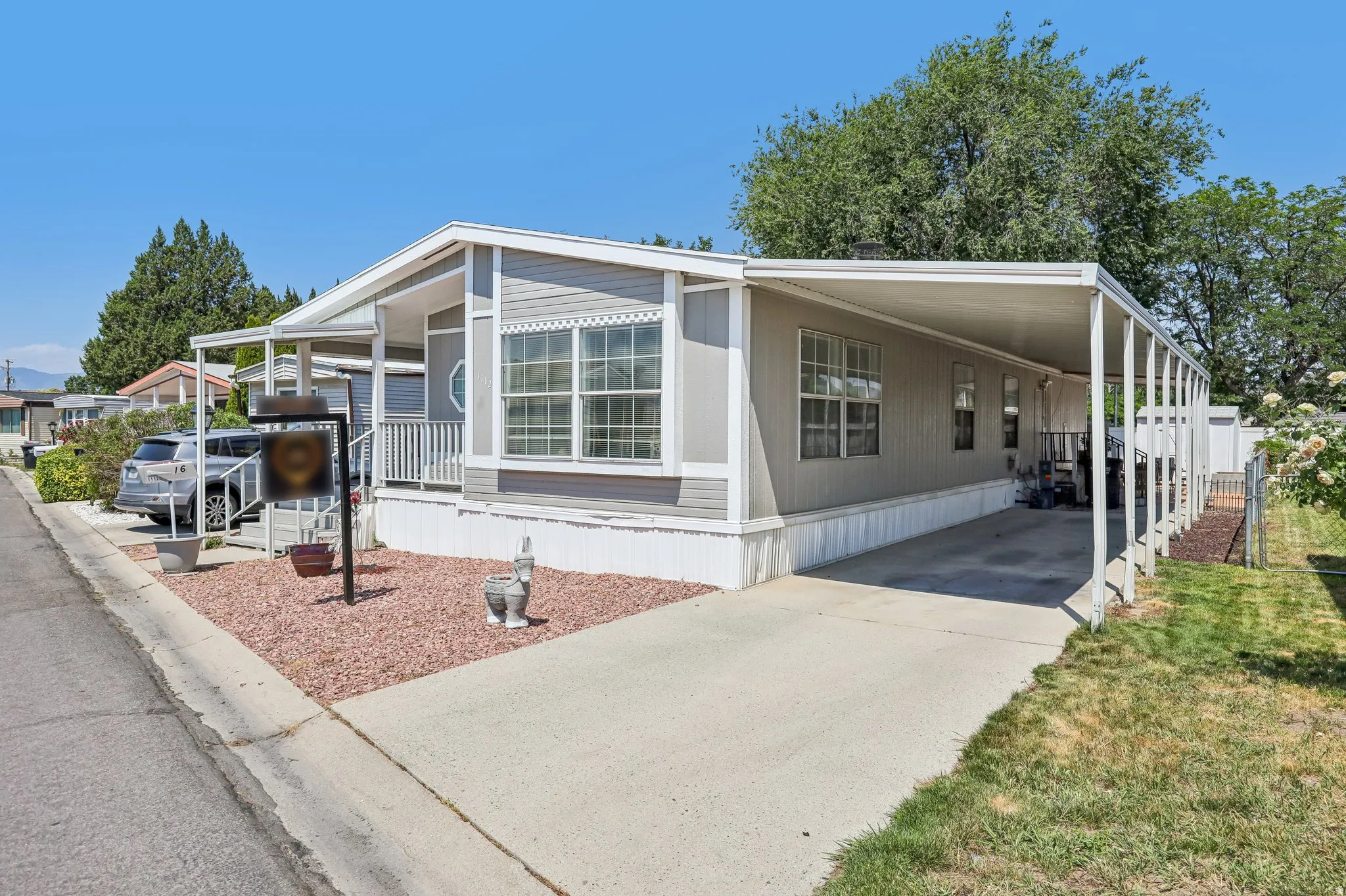 Light grey siding exterior with white trim details