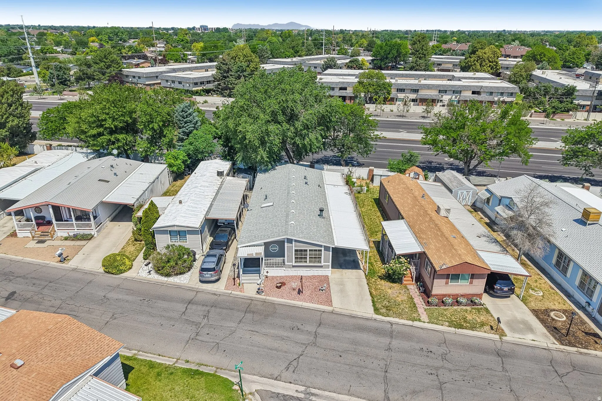 Aerial perspective showcasing residential properties with established landscaping and paved roadways