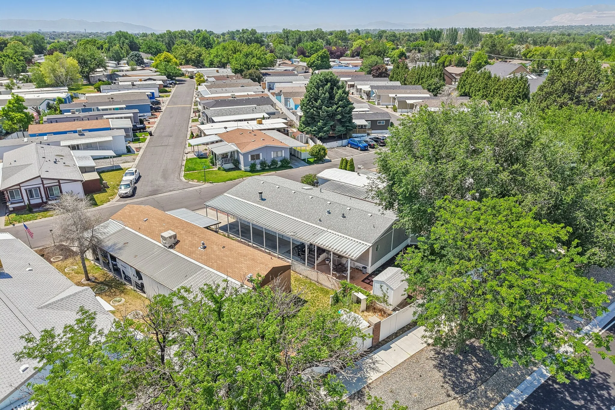 Aerial perspective showcasing a residential community with mature landscaping