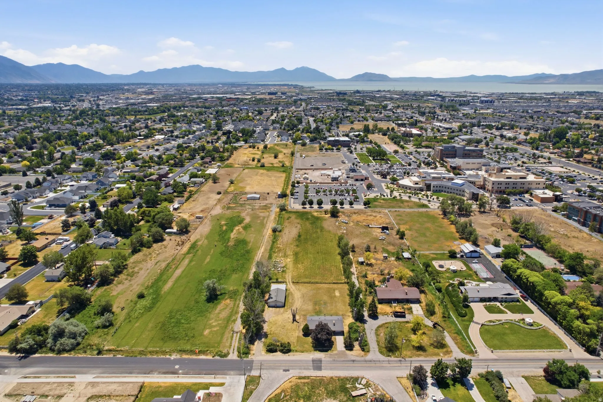Expansive land parcels framed by residential and commercial structures