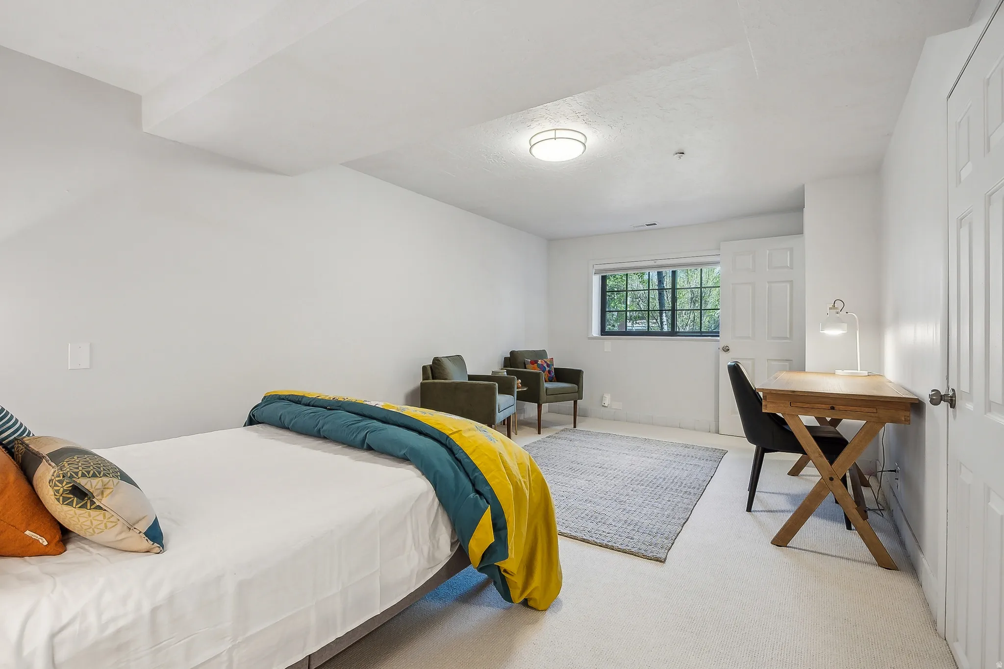 Bright room featuring white walls, a single window, and a flush-mount ceiling light fixture.  Bed is removed, call for details.