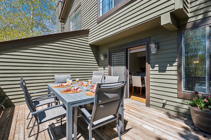 Private outdoor deck with wood flooring