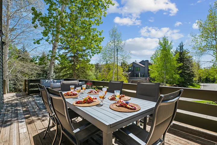 Expansive outdoor deck featuring wood flooring and a privacy railing