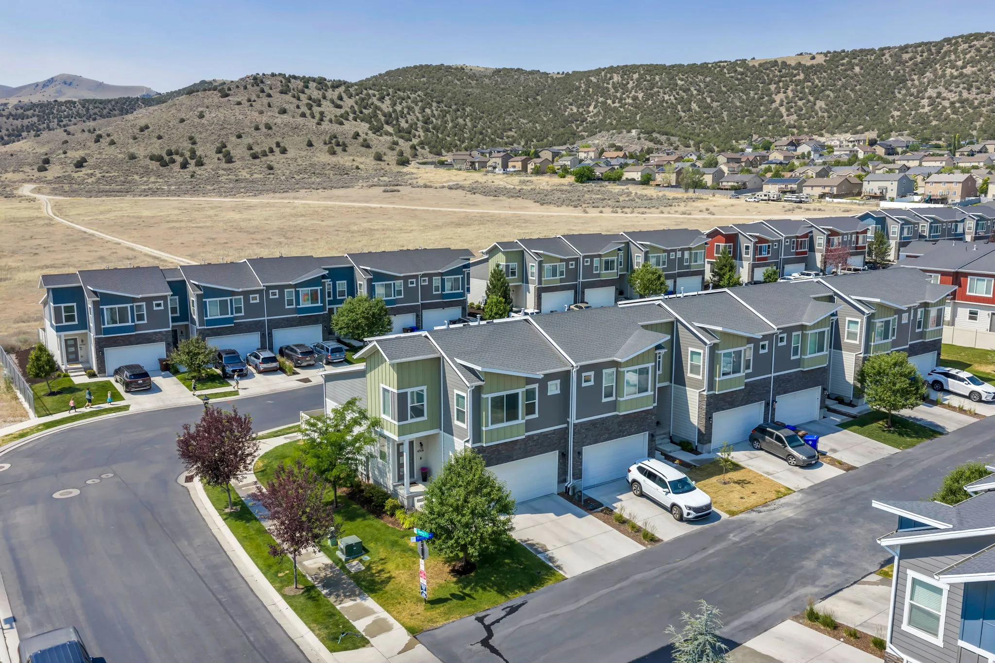 Contemporary townhome community featuring varied exterior color palettes and architectural details