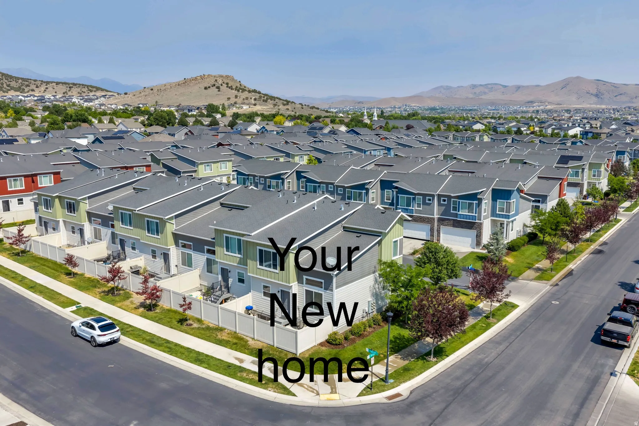 Modern residential development featuring multi-story homes with varied exterior palettes