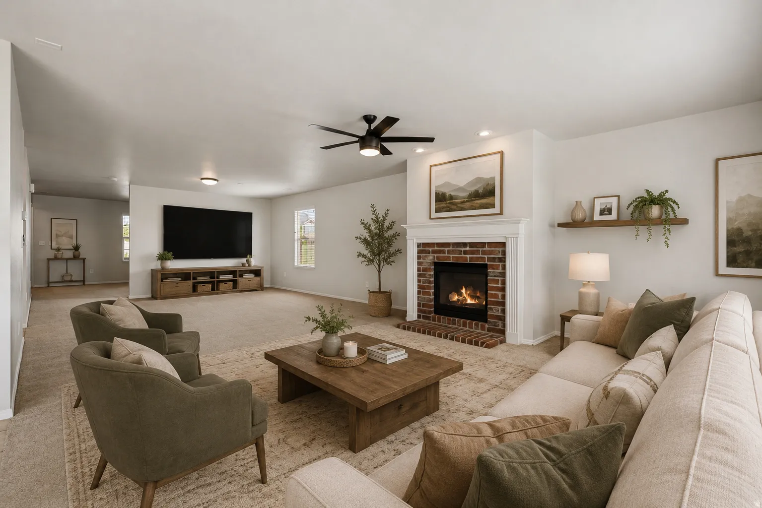 Spacious living area featuring a brick-surround fireplace with a white mantel, ceiling fan, and recessed lighting