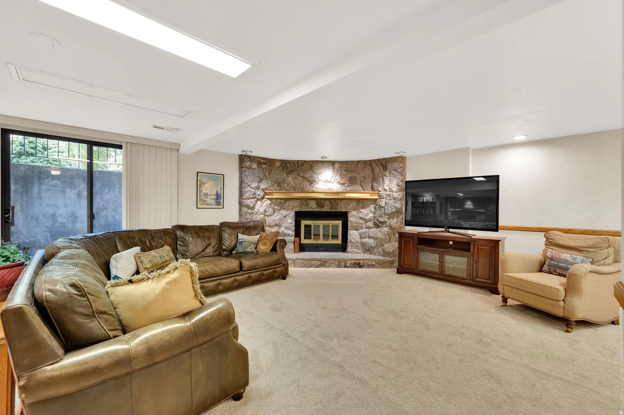 Walk out basement. Corner stone fireplace with a wood mantle and hearth