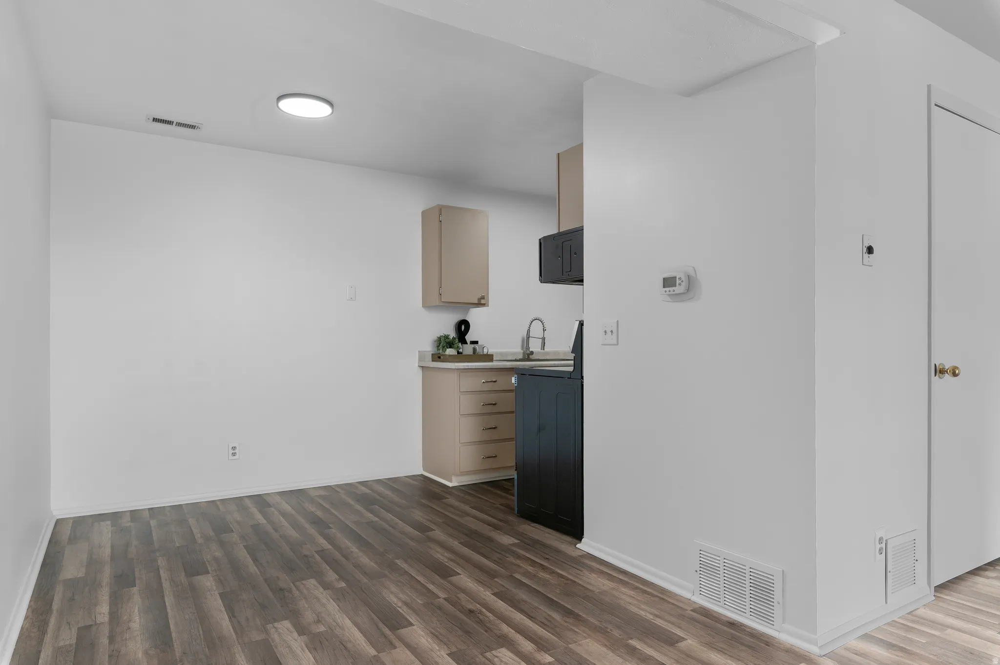Dining nook just off of kitchen and living room, new lighting fixture
