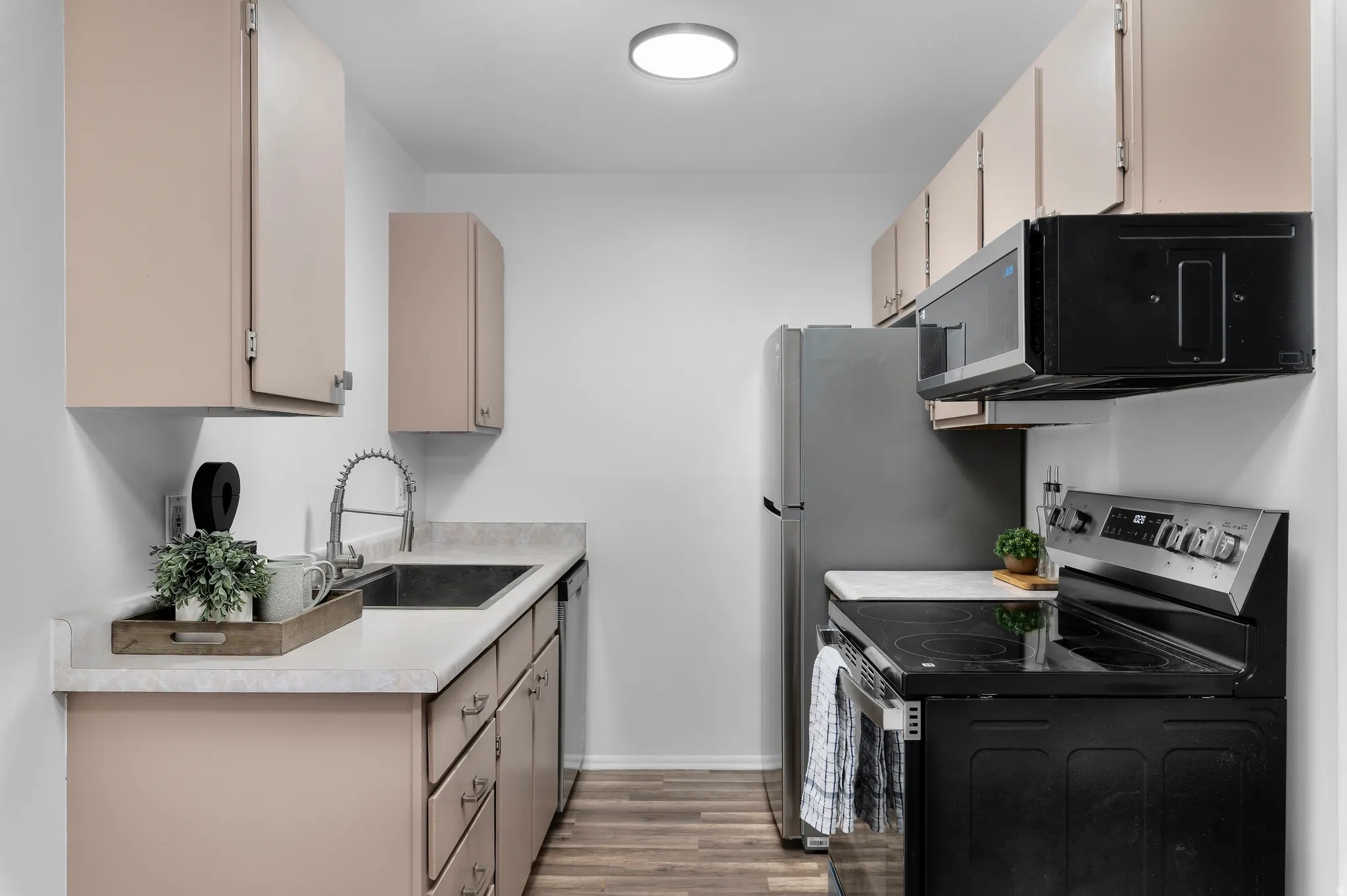 Kitchen featuring all new stainless steel appliances (included)
