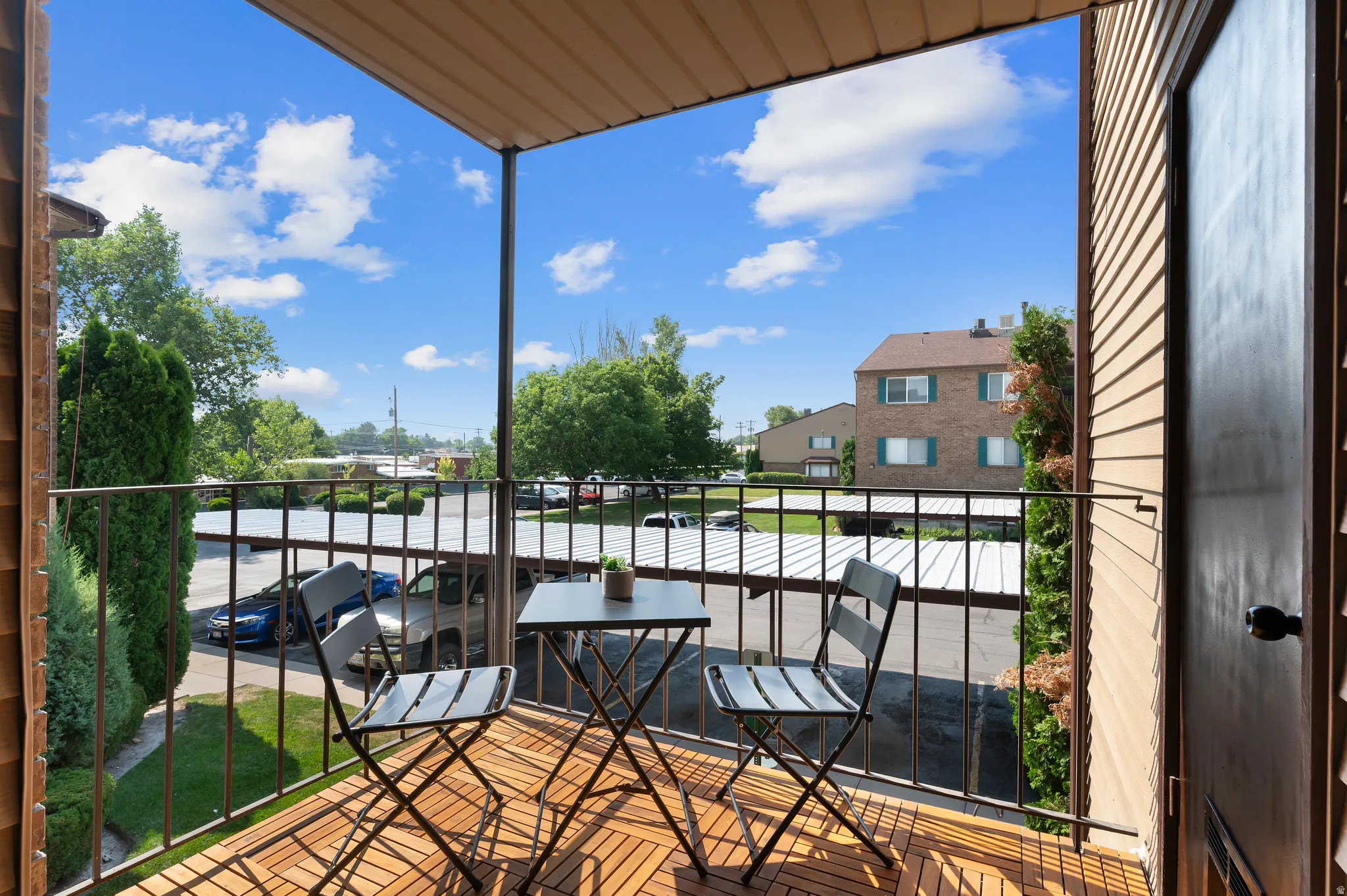Private balcony featuring brand new wood-finish flooring, properly prepared with moisture backing, southeast facing