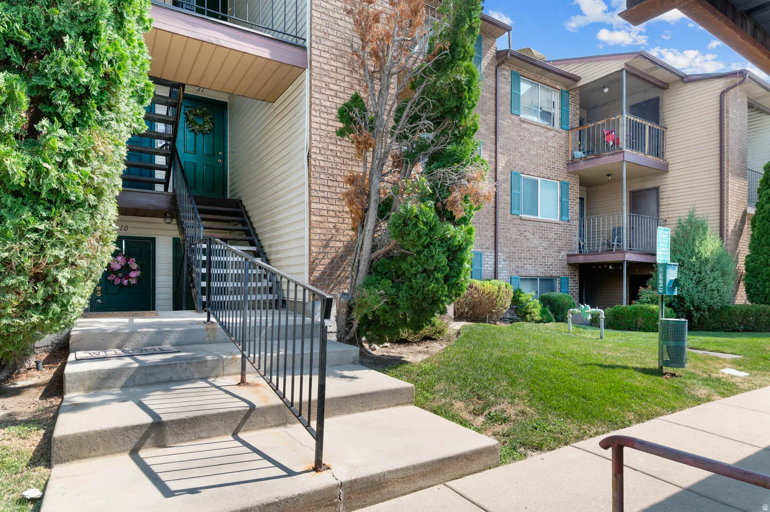 Second level unit on right side; one reserved covered parking spot in front of unit