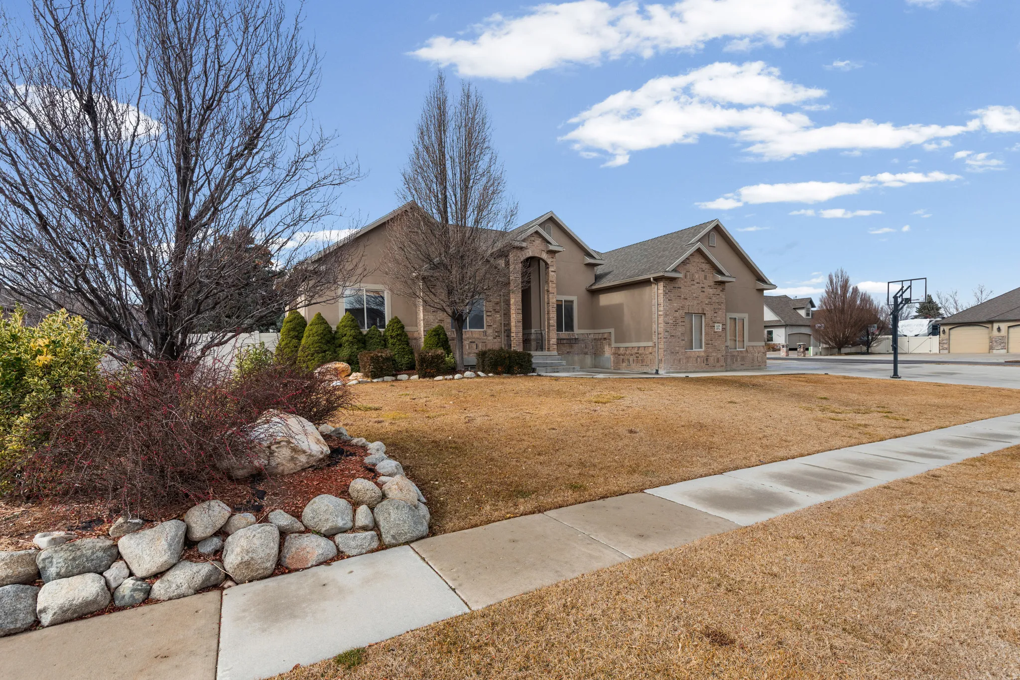 Stucco and brick exterior with arched entry