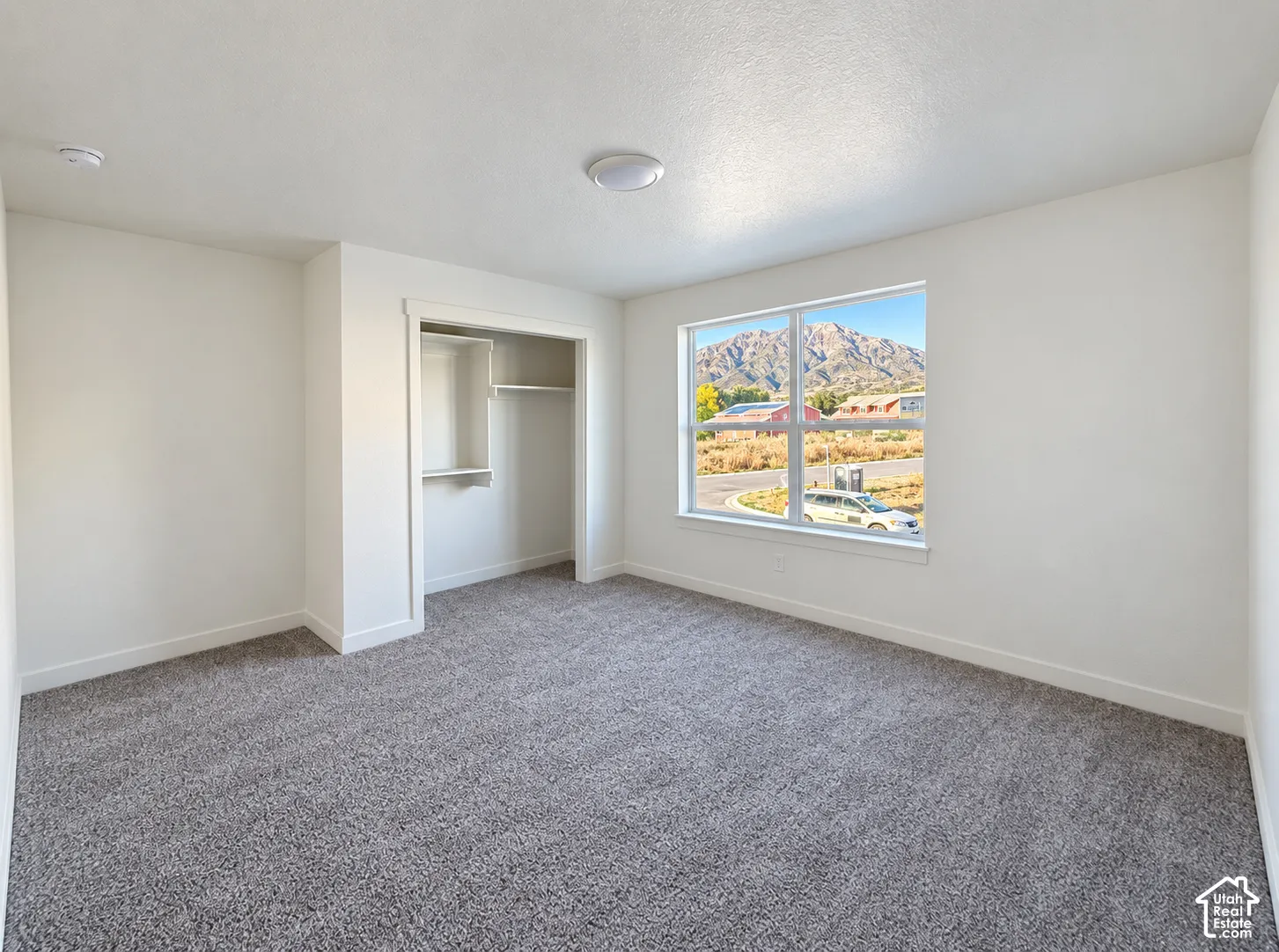 Recessed closet with shelving and hanging rods