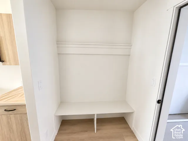 Built-in storage niche featuring a bench and upper shelf