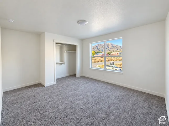 Recessed closet with shelving and hanging rods