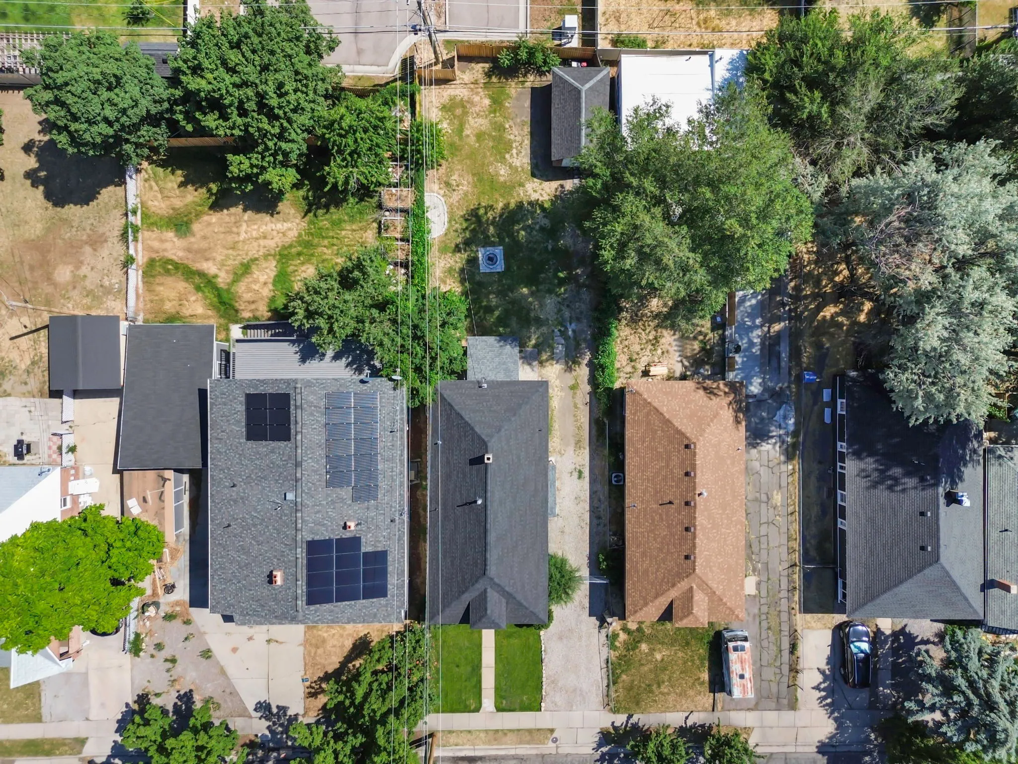 Aerial perspective showcasing two properties with distinct features