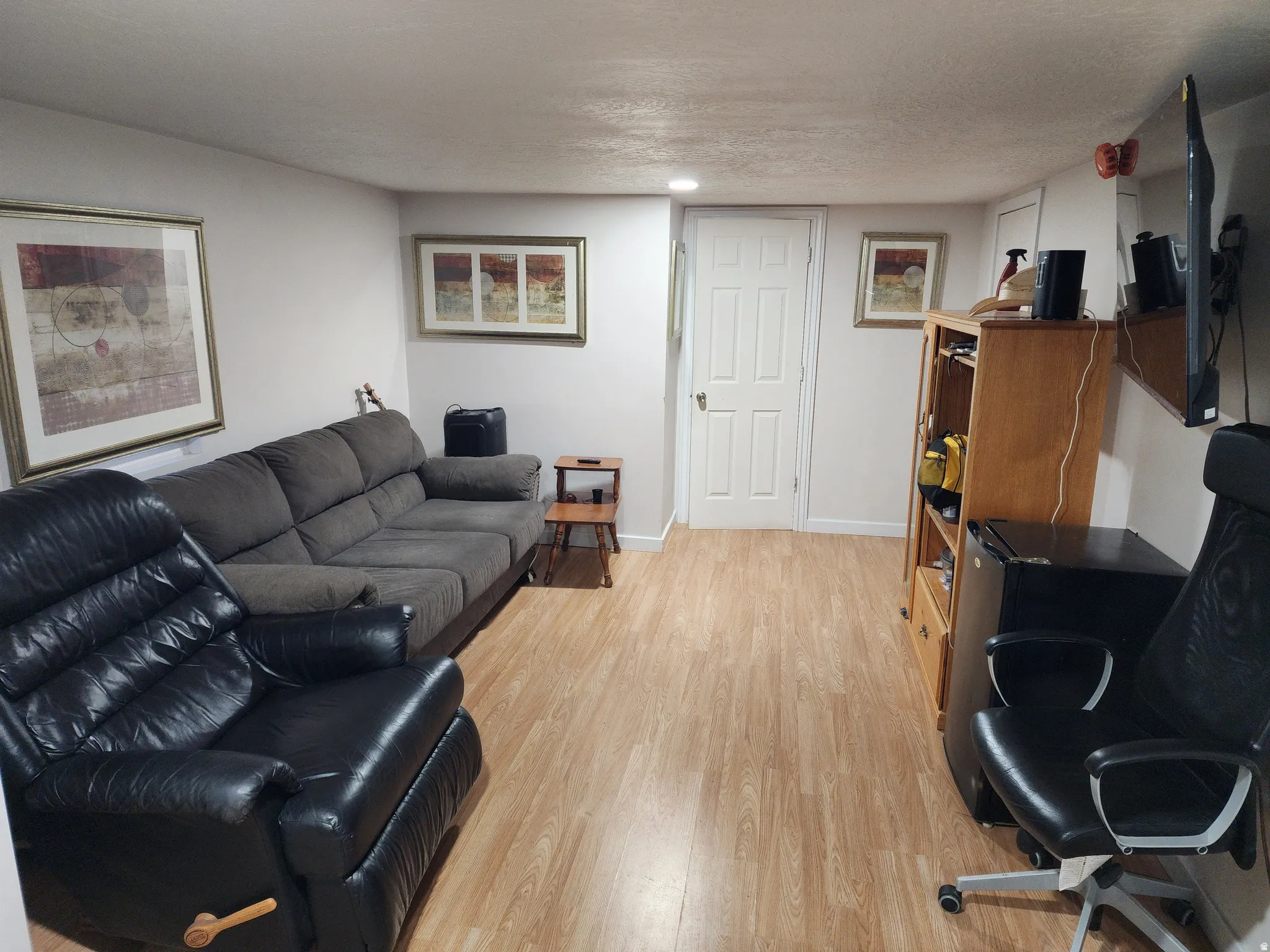 Room featuring light wood-finish flooring and neutral wall tones
