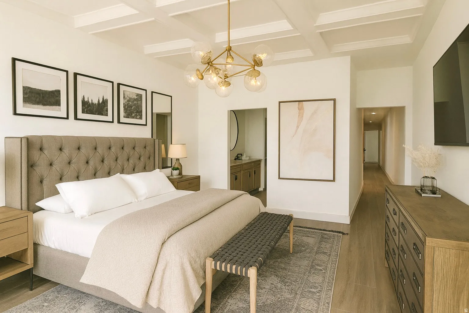 Bright bedroom with coffered ceiling and wood-finish flooring