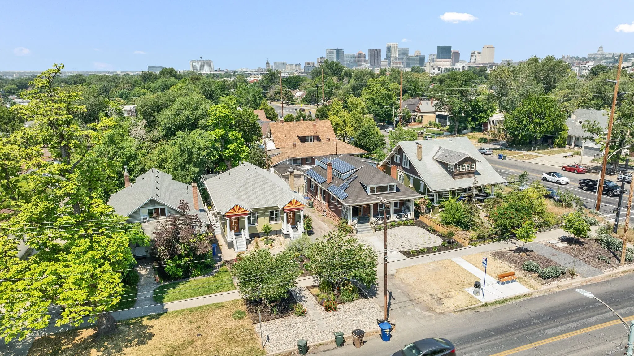 Drone shot with city skyline in the background.