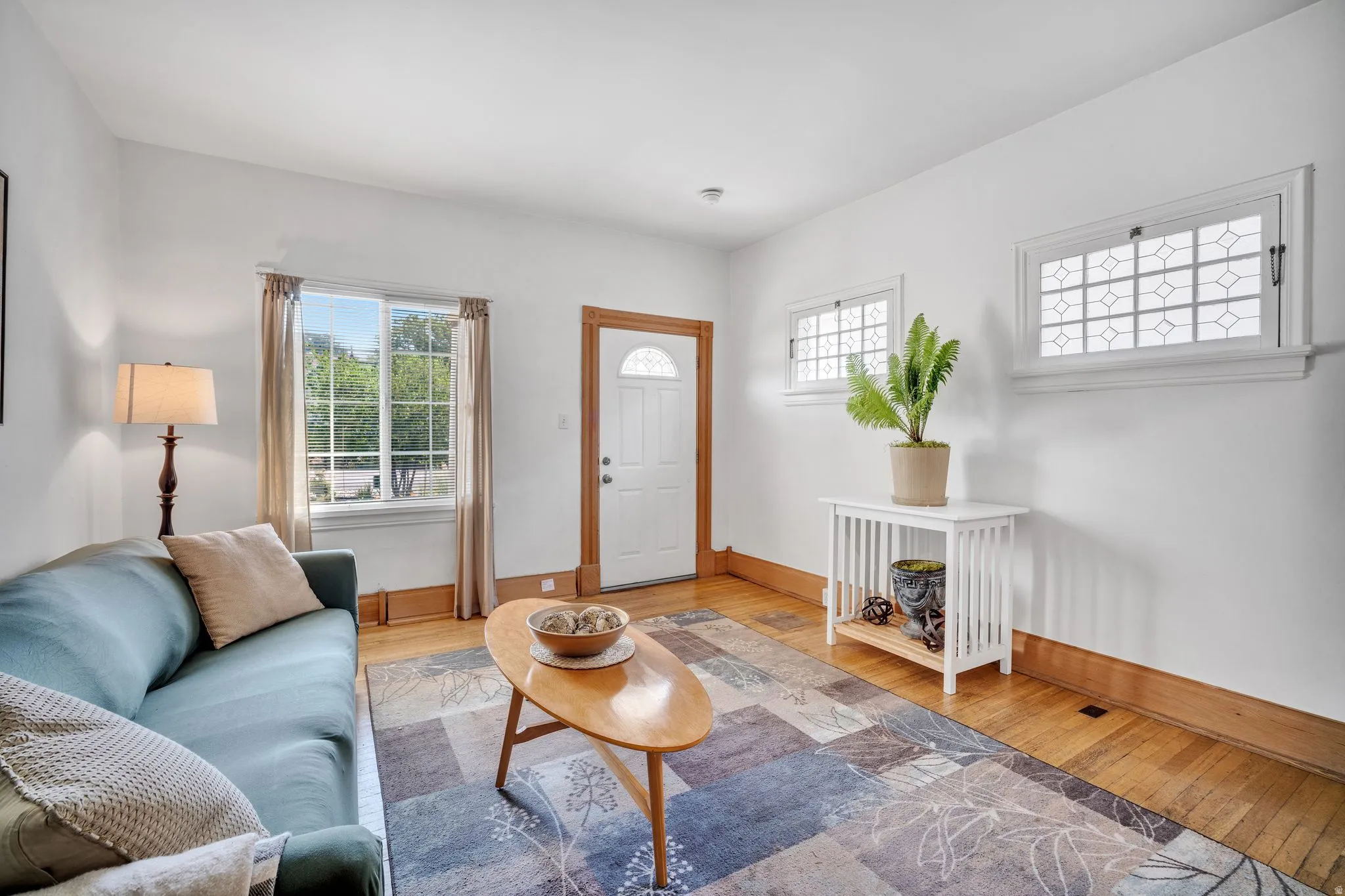 2-bedroom floorplan (614) living area featuring wood-finish flooring and white baseboards
