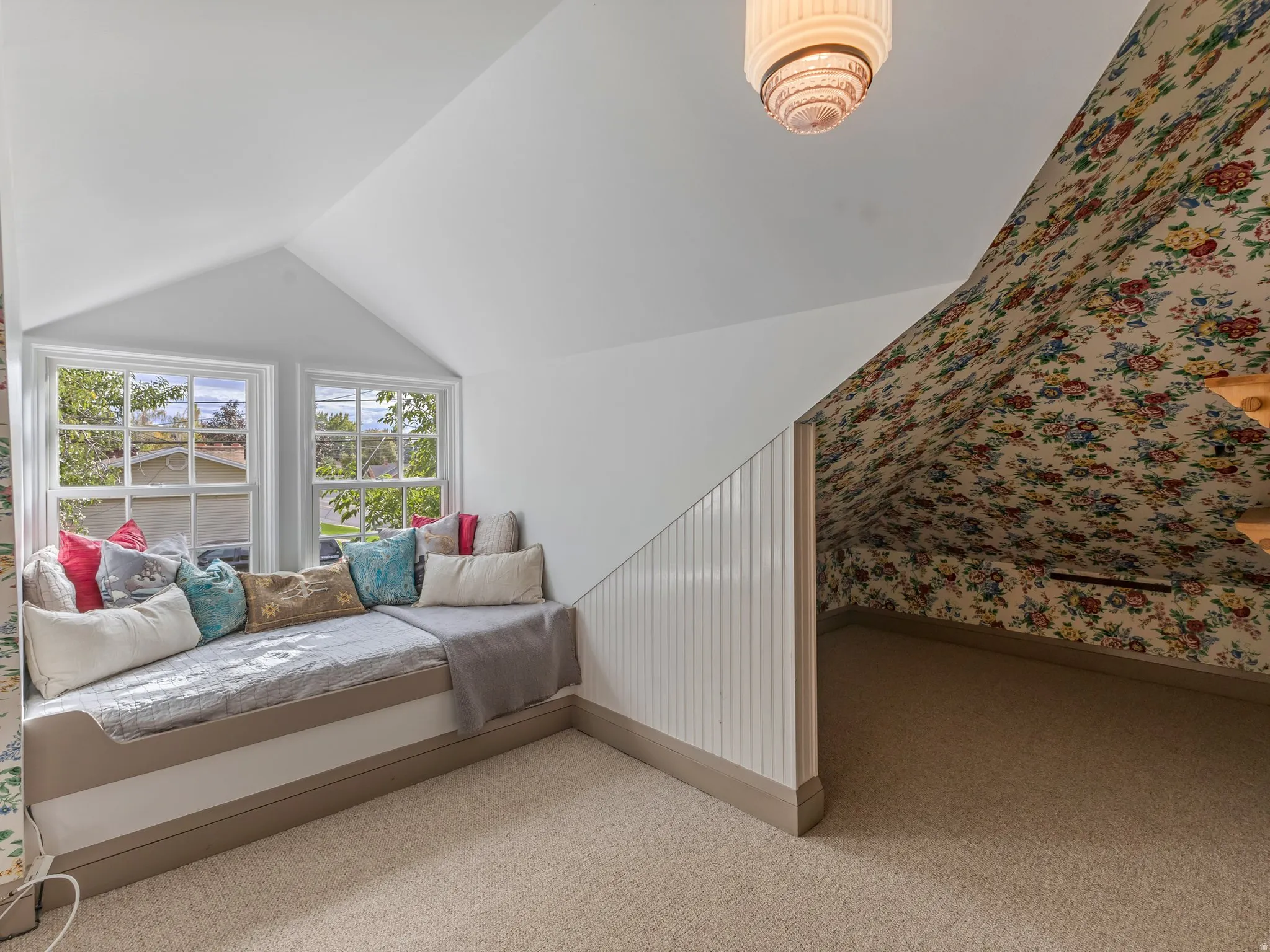 Built-in window seat with storage base and two double-hung windows