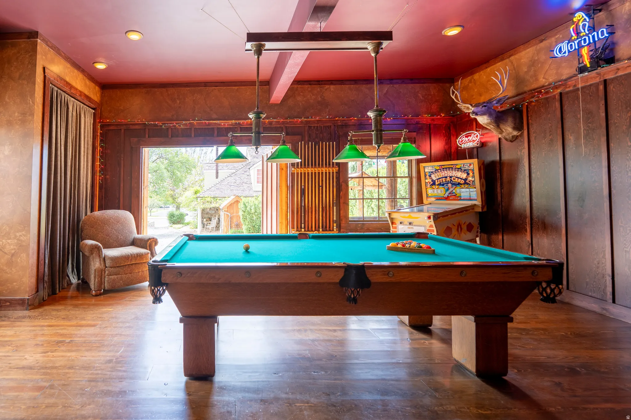 Garage/Game room featuring wood-finish flooring, recessed lighting, and a suspended billiard light fixture