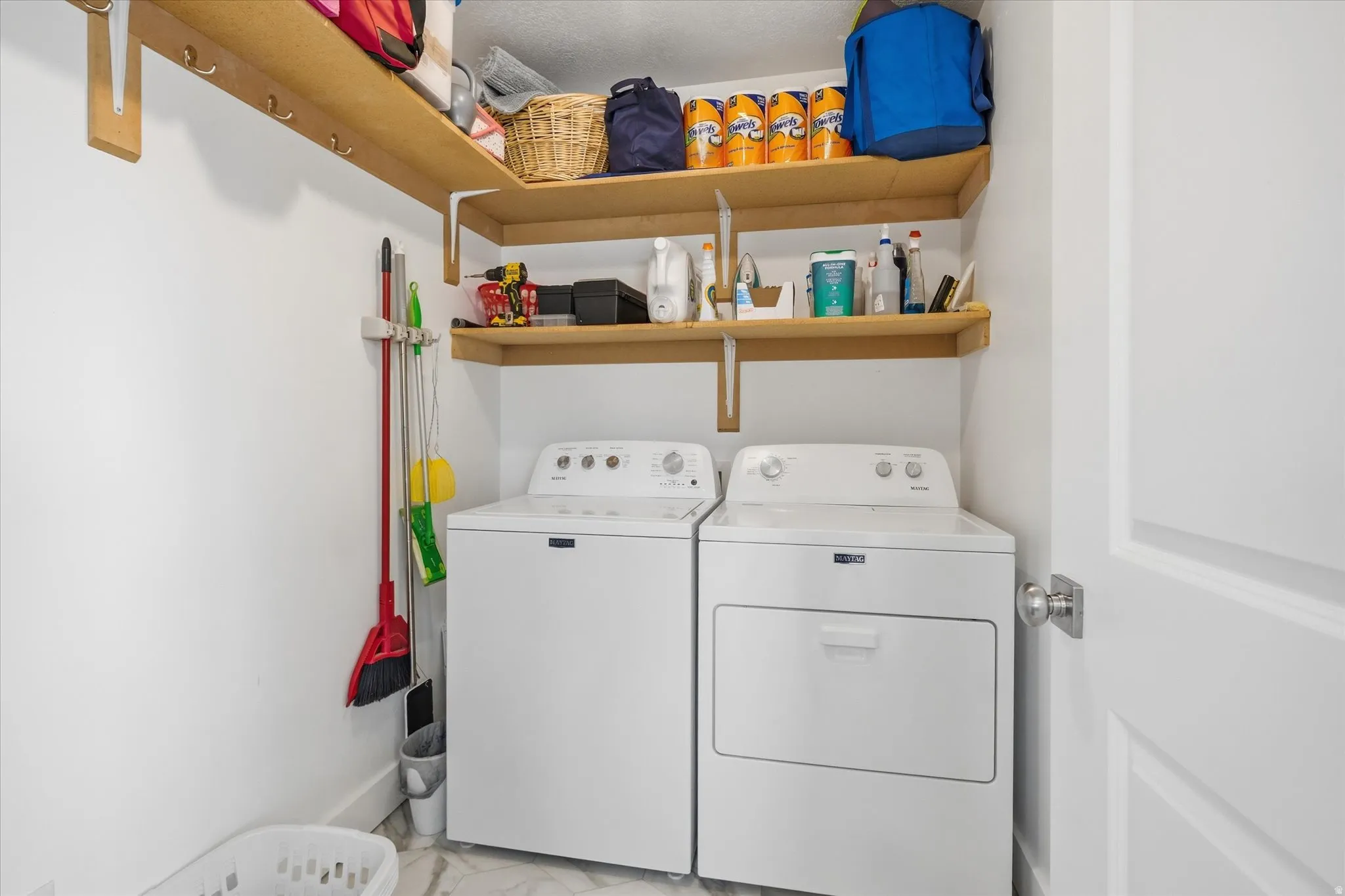 Dedicated laundry area featuring a washer and dryer set