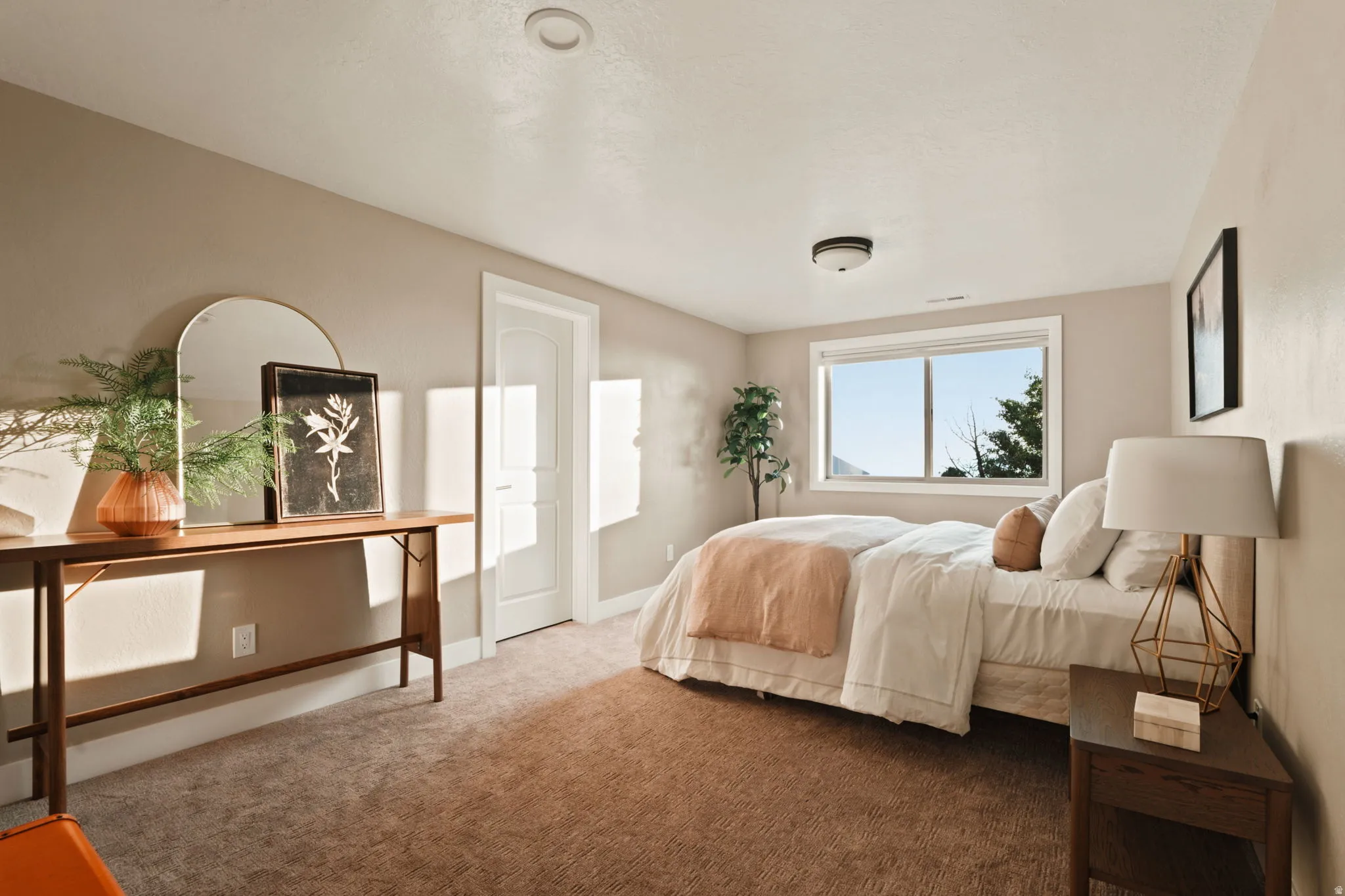 Bedroom featuring plush carpet flooring, a large window, a ceiling-mounted light fixture, and a recessed ceiling light