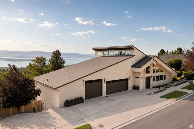 Contemporary residence featuring a distinctive architectural design with a prominent sloped roofline