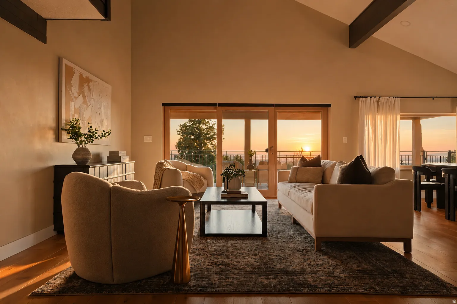 Vaulted ceilings with exposed beams complement the wood-finish flooring