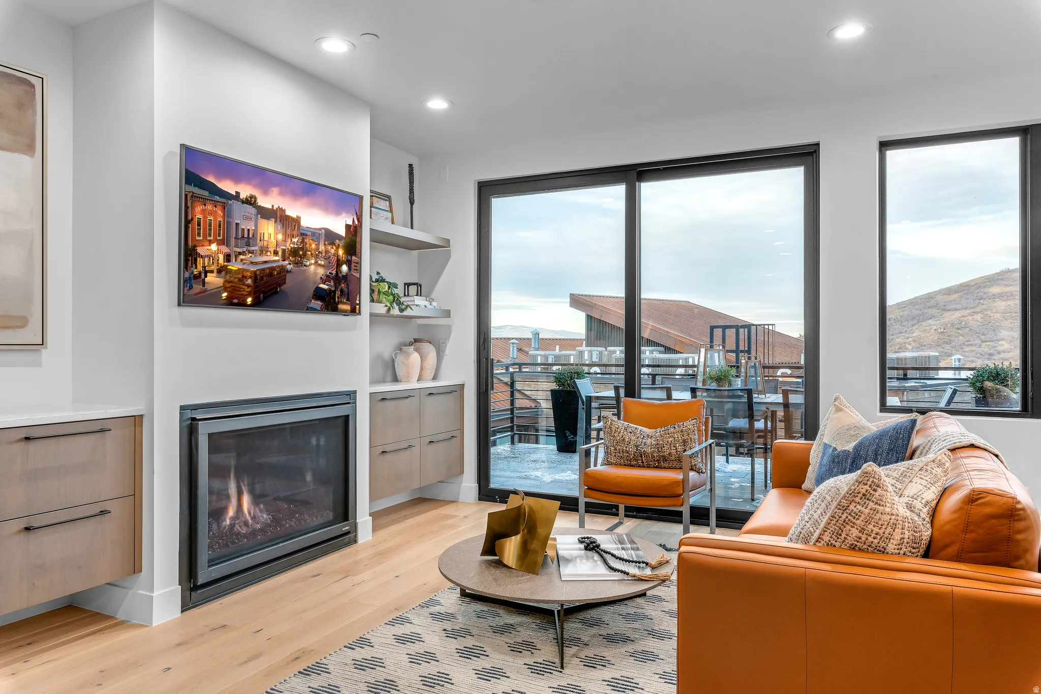 Bright living space featuring wood-finish flooring and a built-in fireplace