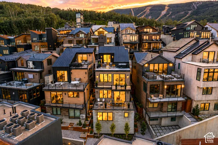 Multi-level residence featuring extensive outdoor terrace spaces and large windows