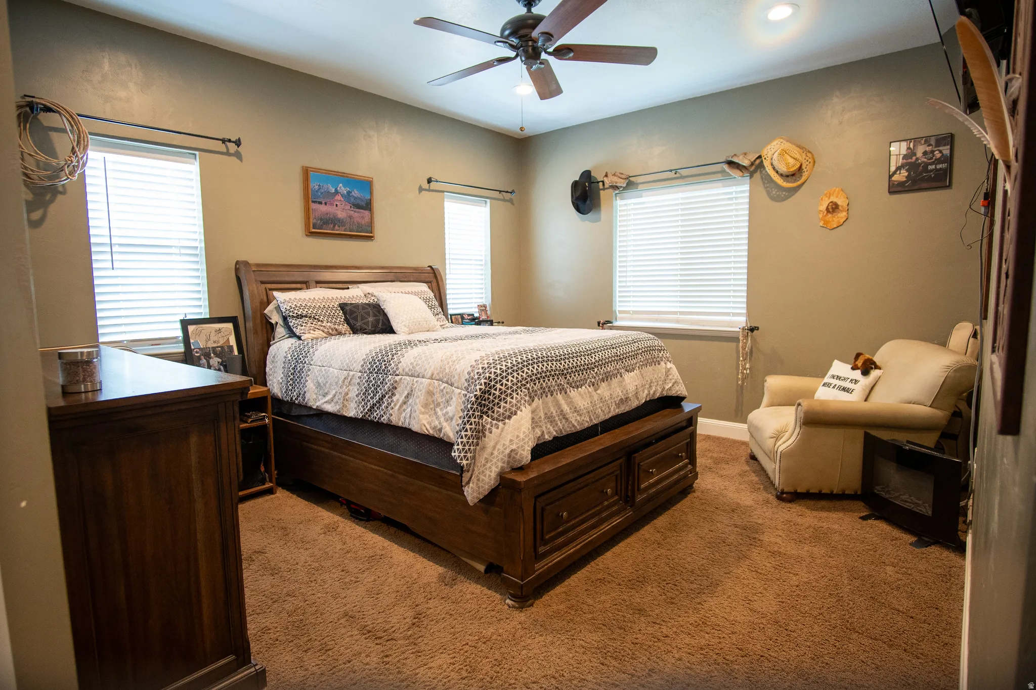 Room with textured wall finish and wood-finish ceiling fan