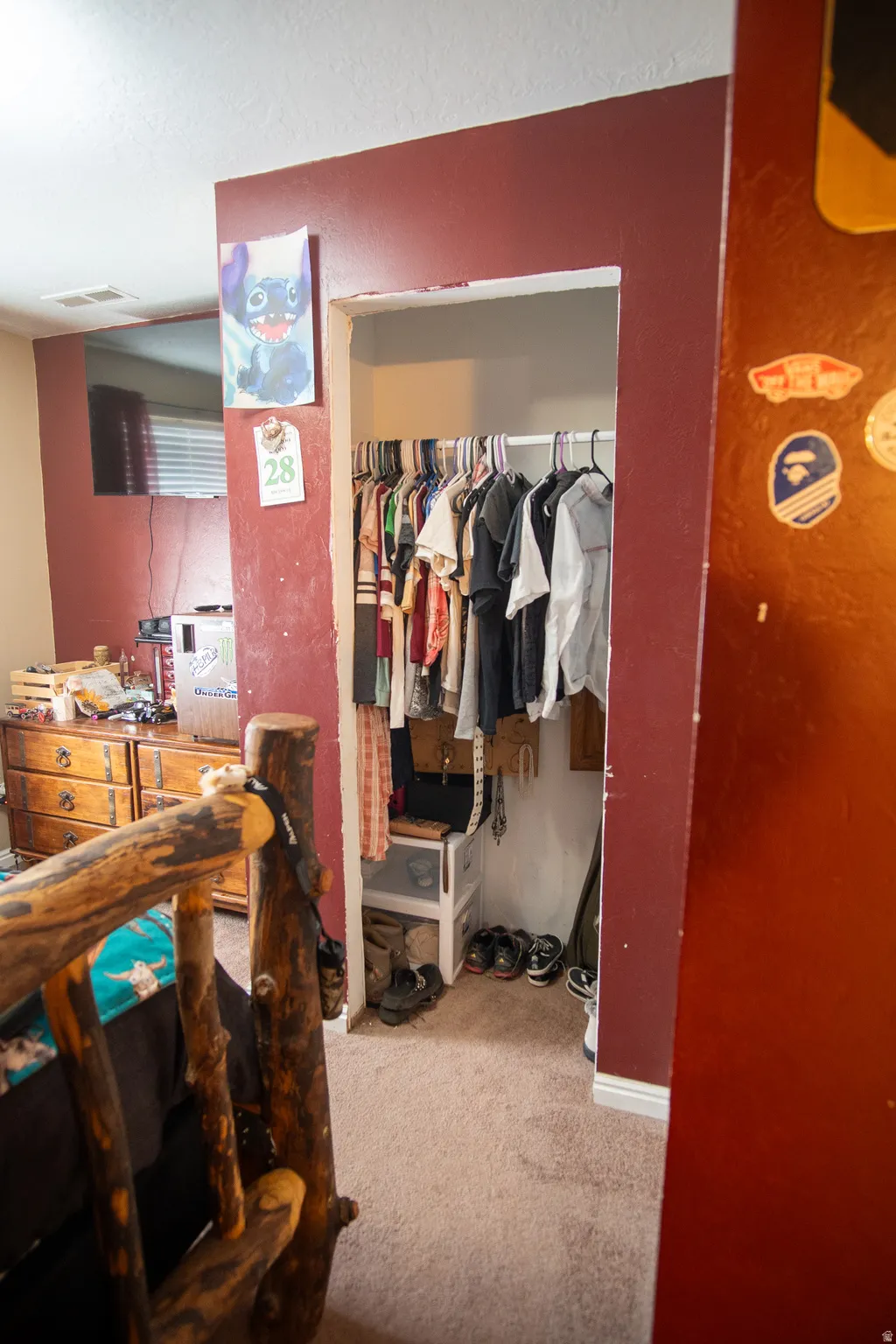 Recessed closet with integrated hanging rod and carpeting