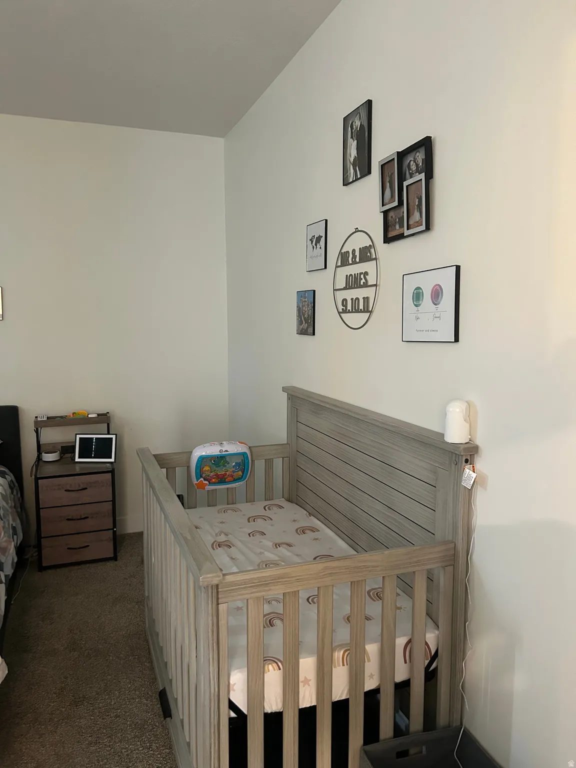 Neutral wall tones complement the neutral carpet flooring