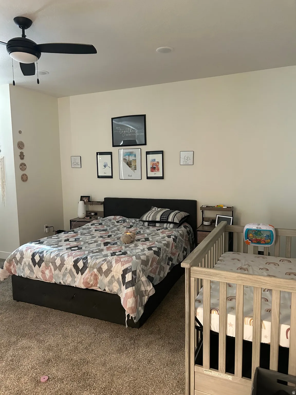 Room featuring light-colored walls and plush carpet flooring