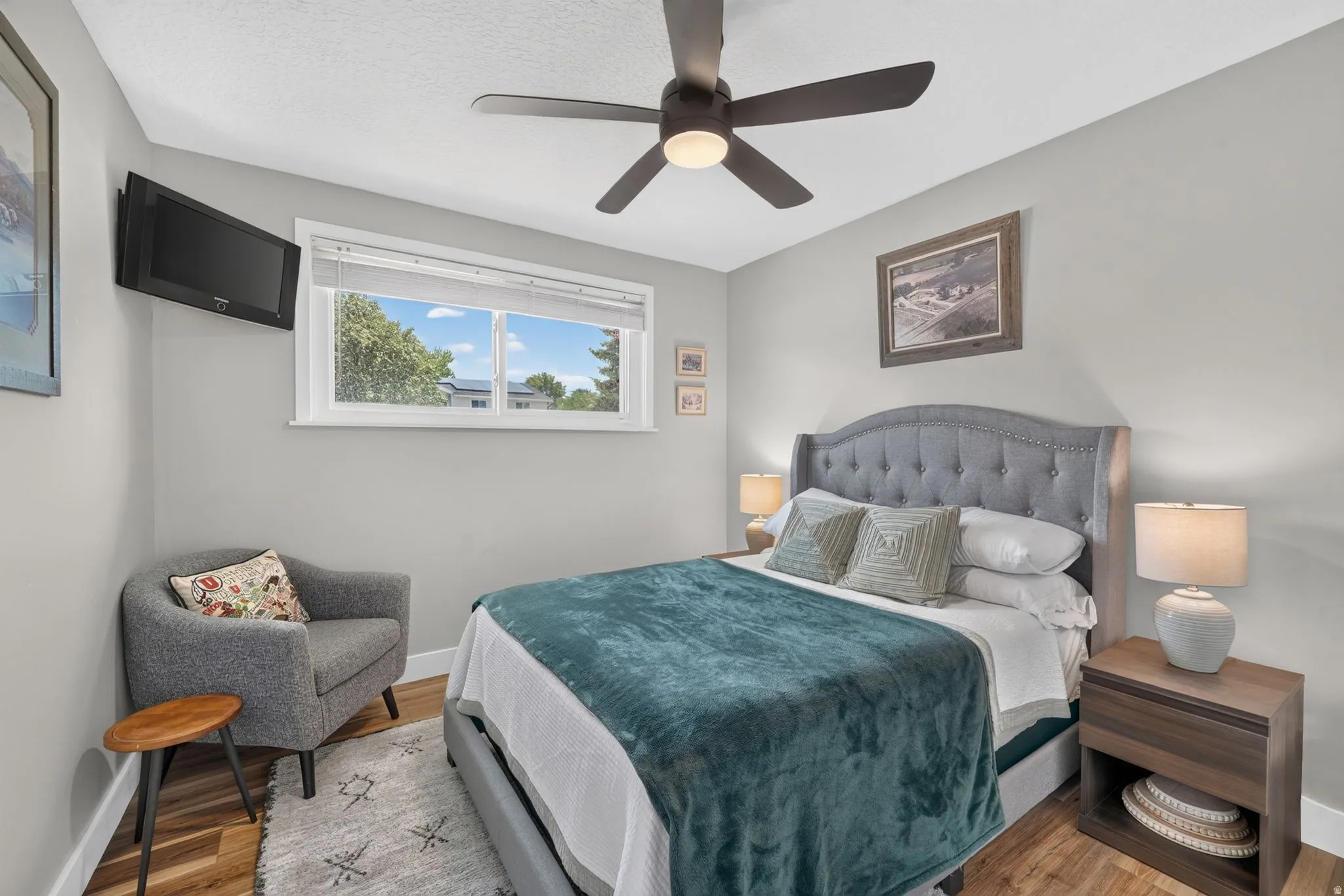 Room featuring wood-finish flooring and light gray walls