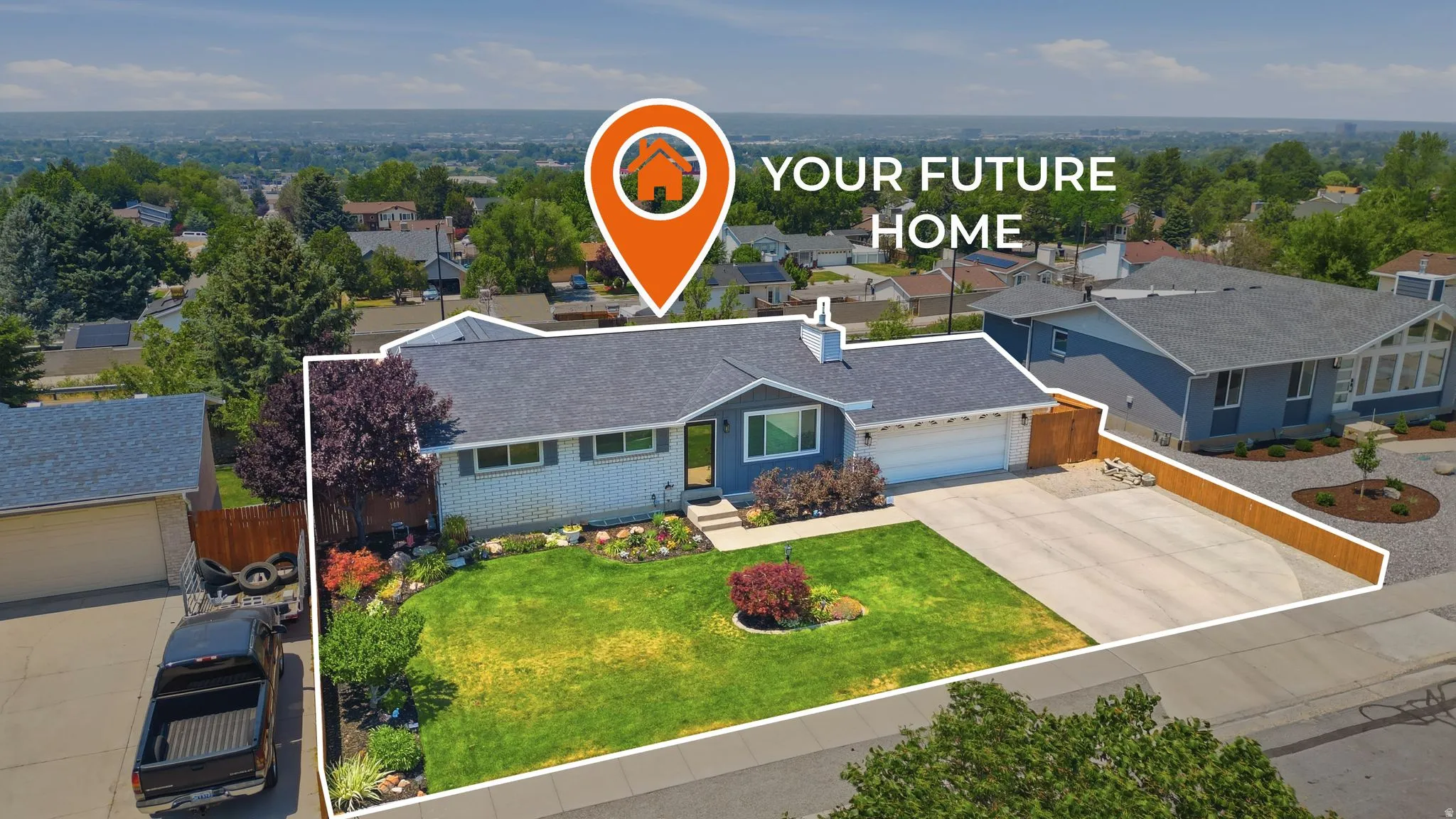 Single-story residence featuring a dark gray shingle roof and a two-car garage