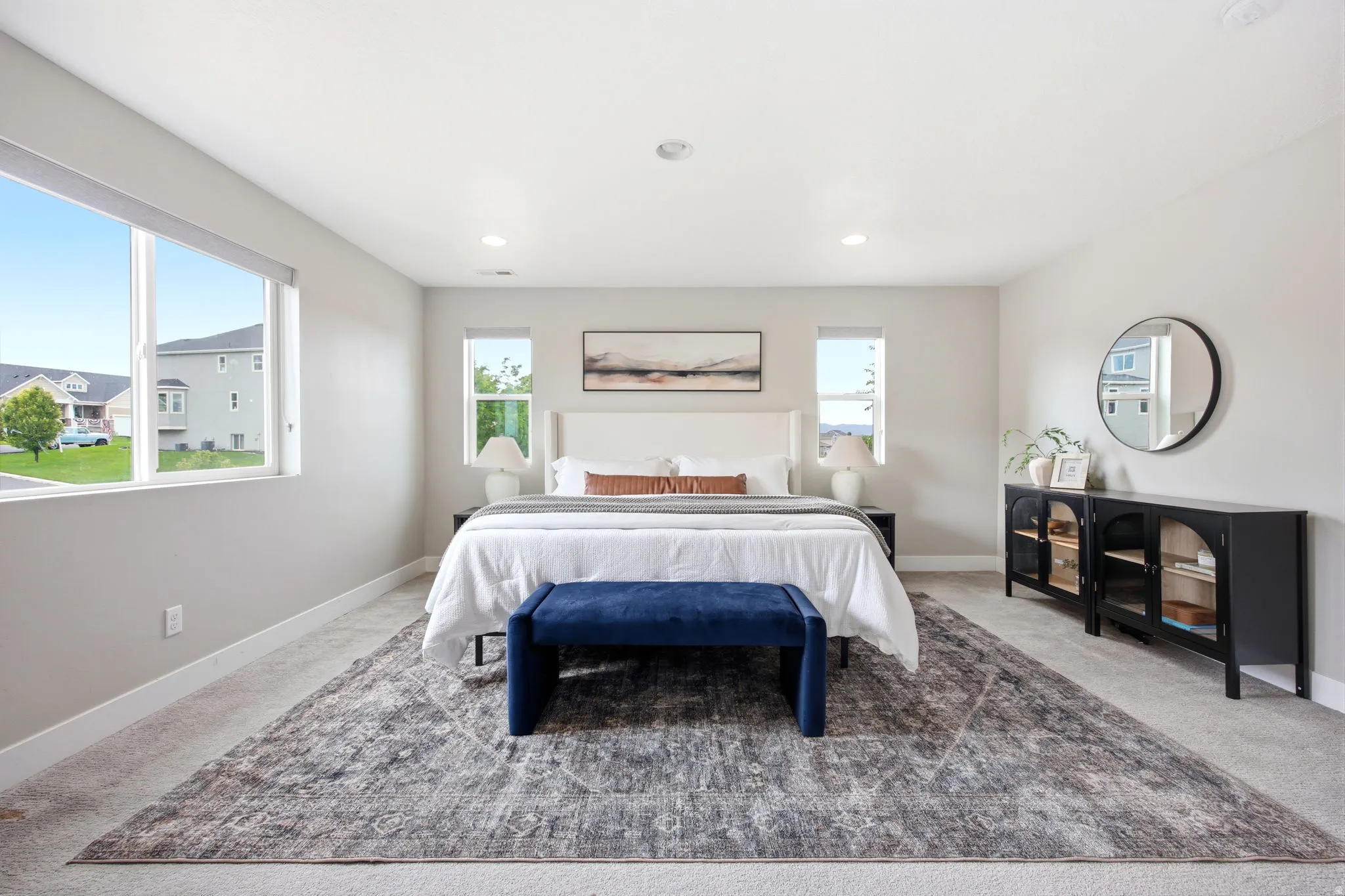Bright interior featuring large windows, recessed lighting, and light-toned wall finishes