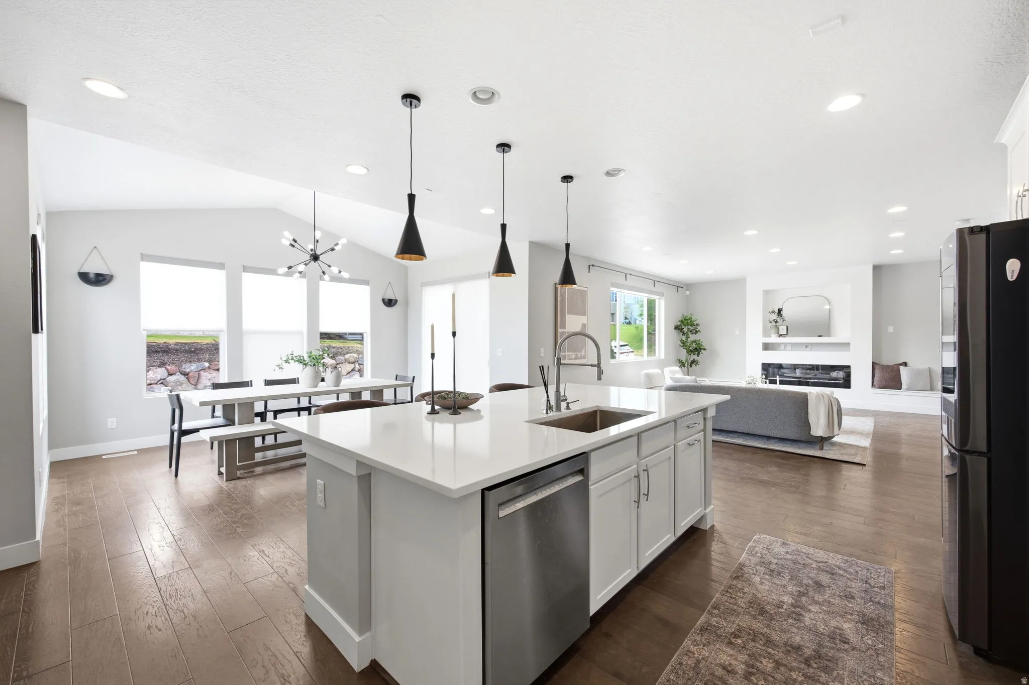 Open-concept living space with wood-finish flooring
