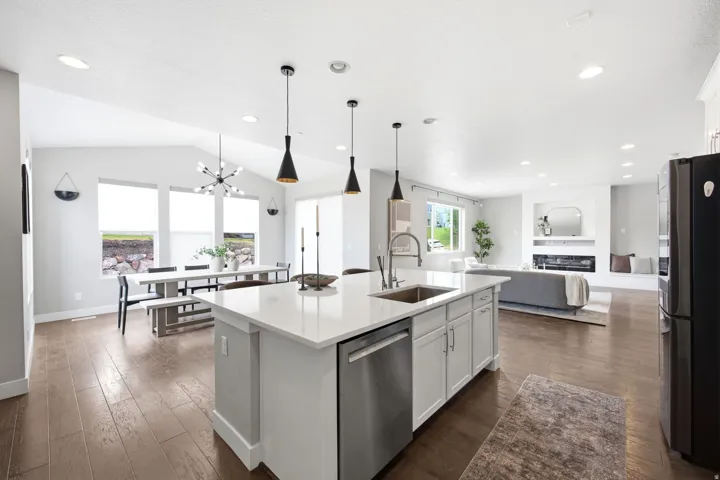 Open-concept living space with wood-finish flooring