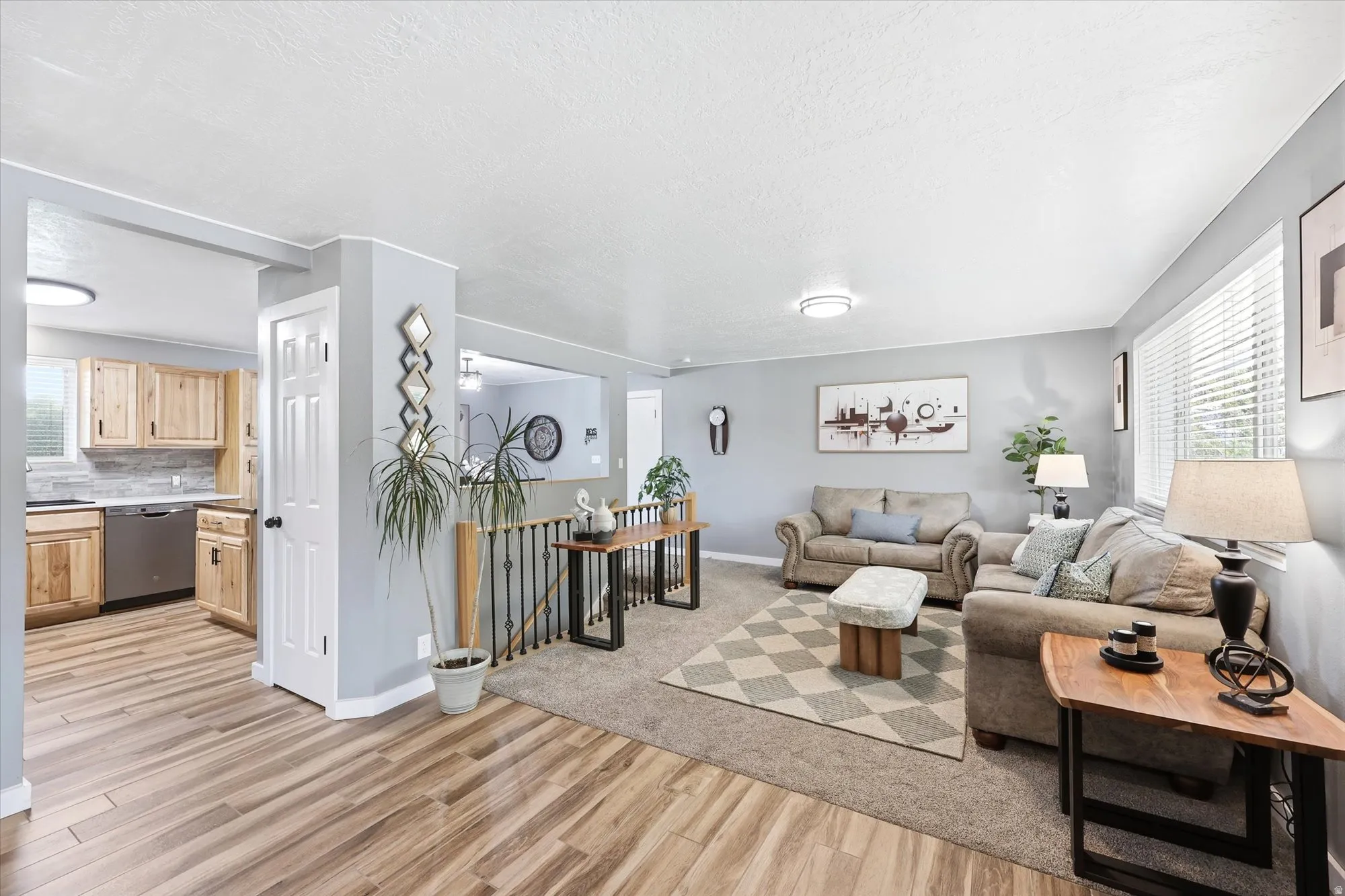 Open-concept living area featuring light gray walls and a cohesive design