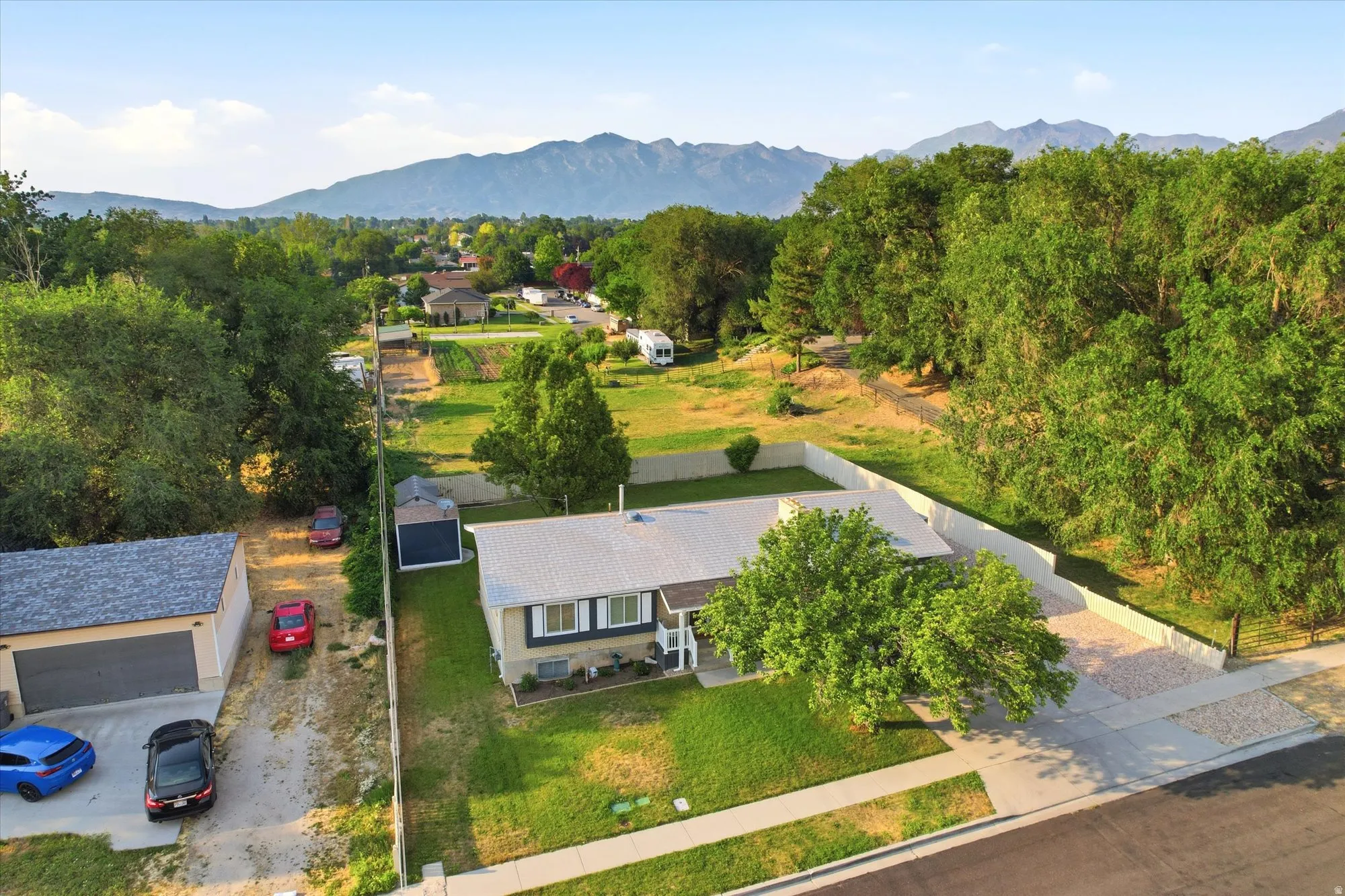 Aerial perspective showcasing a single-story residence with a light-colored roof