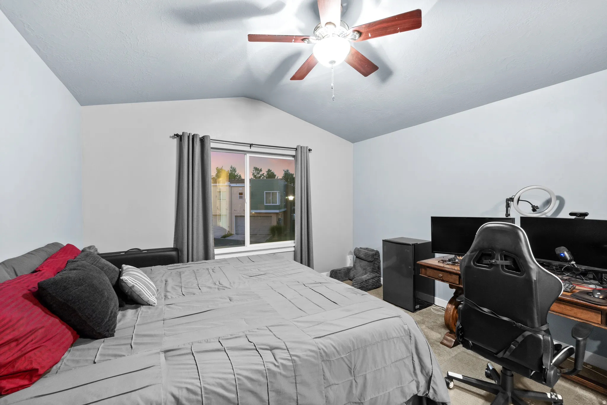 The large En Suite Primary bedroom feels extra luxurious with a vaulted ceiling, a large window with lots of natural light and plenty of room to work from home if you want.