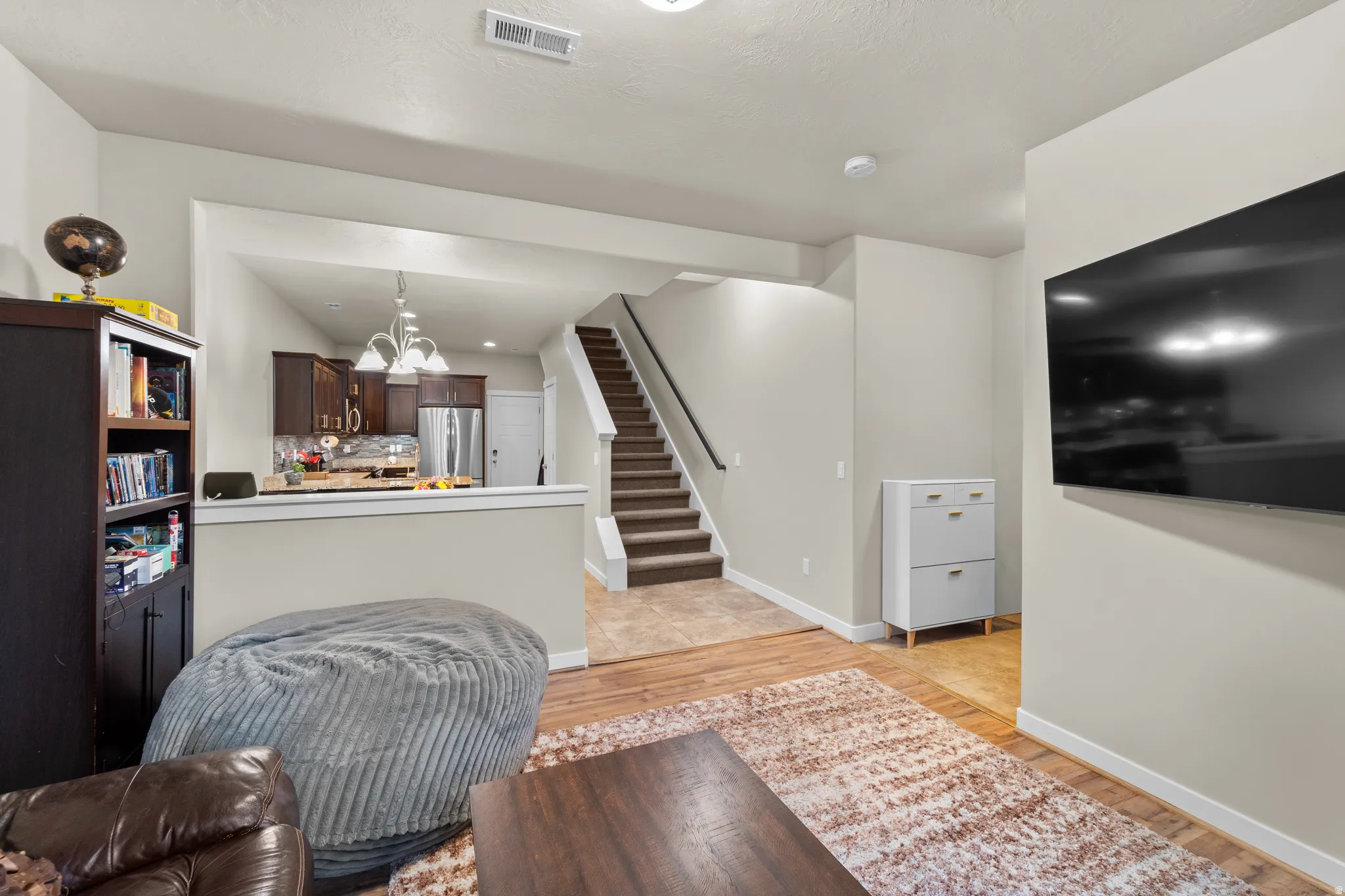 The living room has three large south facing windows to let in plenty of natural light.